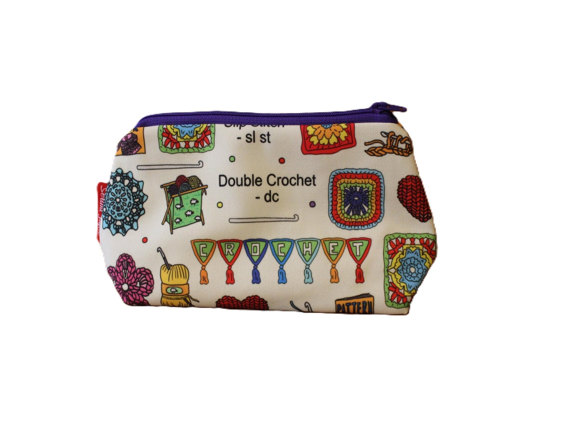 Crochet cosmetic bag with vibrant craft-themed print