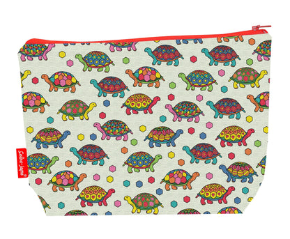 Tortoise toiletry bag with charming reptile print showing washable lining and colour-coordinated zip